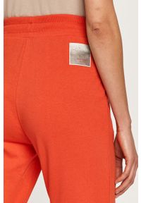 Armani Exchange - Spodnie. Kolor: czerwony. Materiał: bawełna, materiał, dzianina, elastan. Wzór: gładki #2