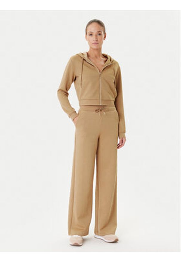 Guess Spodnie dresowe V5YB19 KBSL2 Beżowy Regular Fit. Kolor: beżowy. Materiał: syntetyk