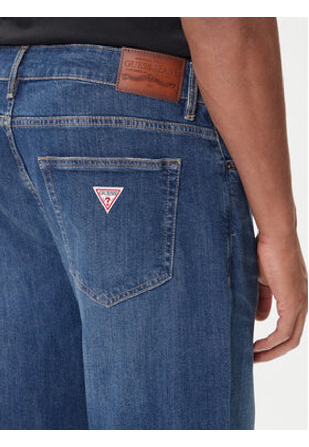Guess Jeans Jeansy M5BA90 D002C Niebieski Tapered Fit. Kolor: niebieski
