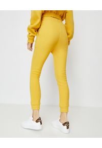 JOANNA MUZYK - Żółte spodnie dresowe Sabrina. Stan: podwyższony. Kolor: żółty. Materiał: dresówka