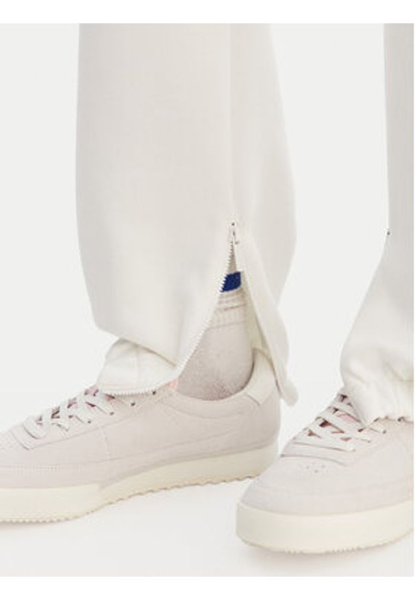 Lacoste Spodnie dresowe XF5244 Écru Regular Fit. Materiał: syntetyk