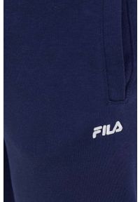 Fila spodnie dresowe kolor granatowy gładkie. Kolor: niebieski. Materiał: dresówka. Wzór: gładki #3