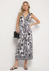 Born2be - Czarna Sukienka z Roślinnym Wzorem i Kopertowym Dekoltem z Gumką w Talii Orrune. Okazja: do pracy, na co dzień, na spotkanie biznesowe. Typ kołnierza: dekolt kopertowy. Kolor: czarny. Materiał: jeans. Sezon: lato. Typ sukienki: kopertowe. Styl: casual, klasyczny, biznesowy #4