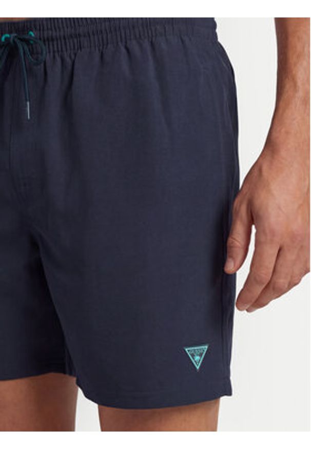 Guess Szorty kąpielowe F6GT24 WG282 MEDIUM Granatowy Regular Fit. Kolor: niebieski. Materiał: syntetyk