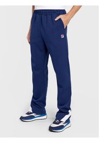 Fila Spodnie dresowe Zigong FAM0169 Granatowy Regular Fit. Kolor: niebieski. Materiał: syntetyk #1