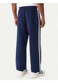 Adidas - adidas Spodnie dresowe adicolor Spacer Track KD4087 Granatowy Baggy Fit. Kolor: niebieski. Materiał: syntetyk. Sport: turystyka piesza #3