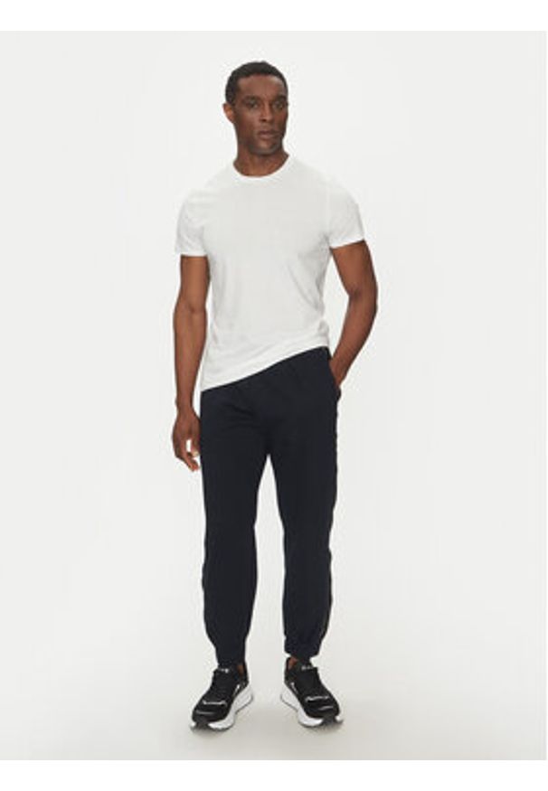 EA7 Emporio Armani Spodnie dresowe 7M000545 AF12660 UB102 Granatowy Modern Fit. Kolor: niebieski. Materiał: syntetyk