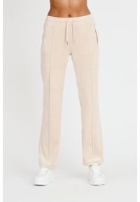 Juicy Couture - JUICY COUTURE Beżowe spodnie Tina Track Pants. Kolor: beżowy. Materiał: dresówka