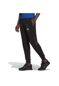 Adidas - Spodnie adidas Essentials Brandlove French Terry HE1776 - czarne. Kolor: czarny. Materiał: dresówka, wiskoza, materiał, bawełna, poliester