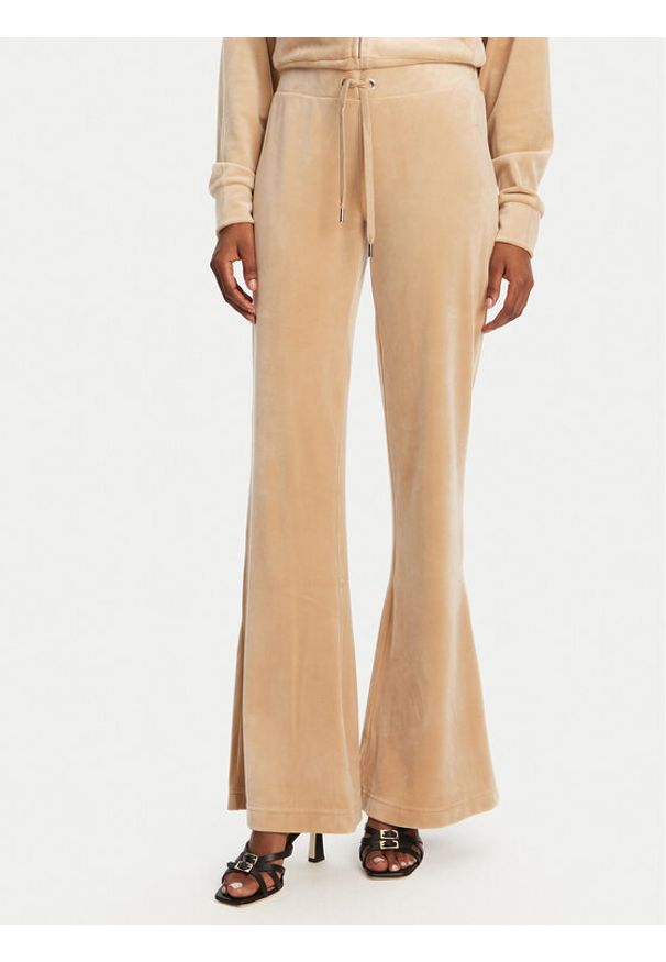 Juicy Couture Spodnie dresowe Christine JCWBJ125304 Beżowy Flared Leg. Kolor: beżowy. Materiał: syntetyk