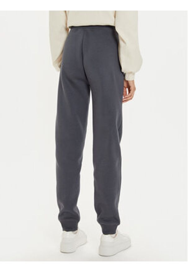 Calvin Klein Jeans Spodnie dresowe Monologo J20J223590 Szary Relaxed Fit. Kolor: szary. Materiał: syntetyk, bawełna