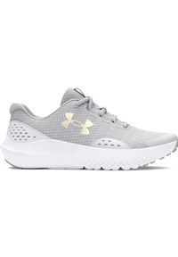 Buty do biegania dziewczęce Under Armour UA Ggs Surge 4 - szare. Kolor: szary. Materiał: syntetyk, guma. Szerokość cholewki: normalna