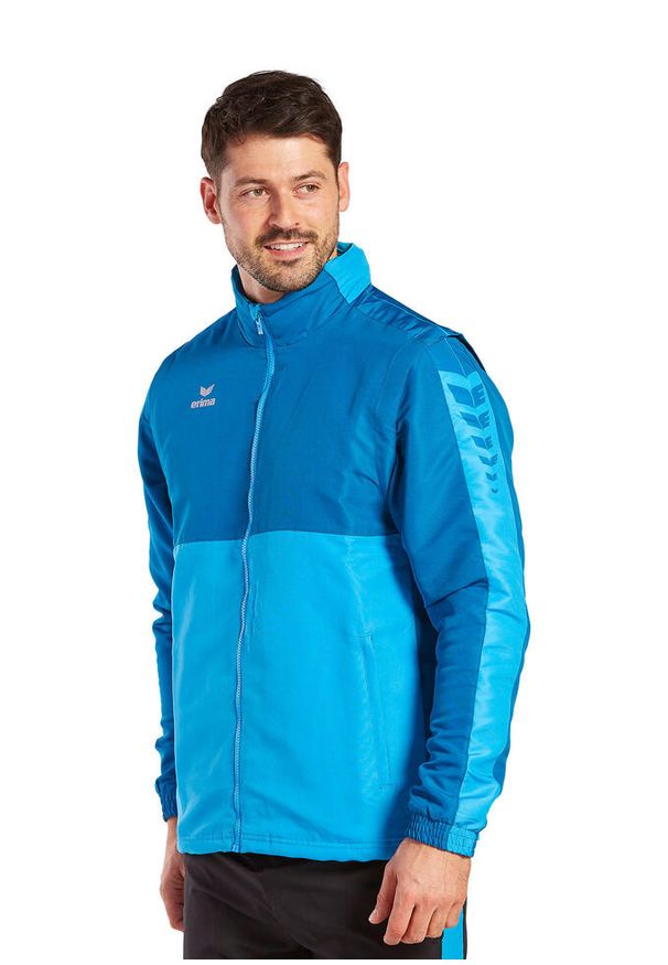 ERIMA - Kurtka Erima Six Wings. Typ kołnierza: kaptur. Kolor: wielokolorowy, niebieski, zielony. Materiał: polar