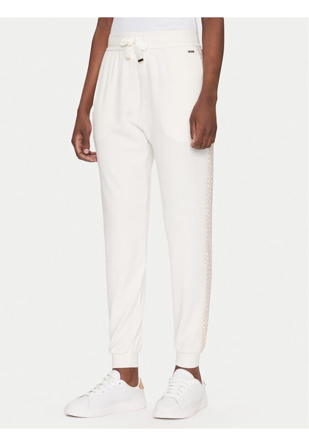 BOSS Spodnie dresowe Monogram 50535841 Écru Regular Fit. Materiał: dresówka, syntetyk