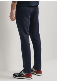 Ochnik - Granatowe spodnie męskie. Kolor: niebieski. Materiał: bawełna