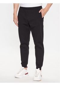 Calvin Klein Spodnie dresowe Logo Tape K10K111565 Czarny Comfort Fit. Kolor: czarny. Materiał: syntetyk, dresówka, bawełna