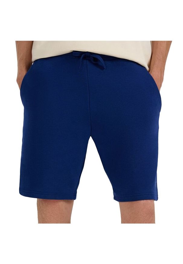 4f - Spodenki męskie 4F WMM00TSHOM543031S - granatowe. Kolor: niebieski. Materiał: bawełna, dresówka. Długość: do kolan. Sport: fitness