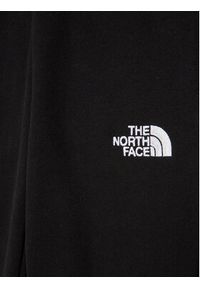 The North Face Spodnie dresowe Teen NF0A82EO Czarny Regular Fit. Kolor: czarny. Materiał: bawełna
