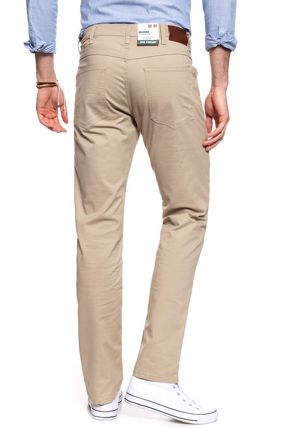 Wrangler - WRANGLER SPODNIE MĘSKIE ARIZONA CORNSTALK W12OV6335 112126479. Materiał: materiał