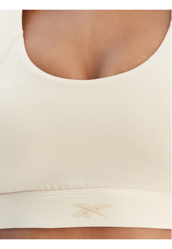 Reebok Biustonosz sportowy Reebok x Ewa Chodakowska RK25615CCW Beżowy. Kolor: beżowy. Materiał: syntetyk