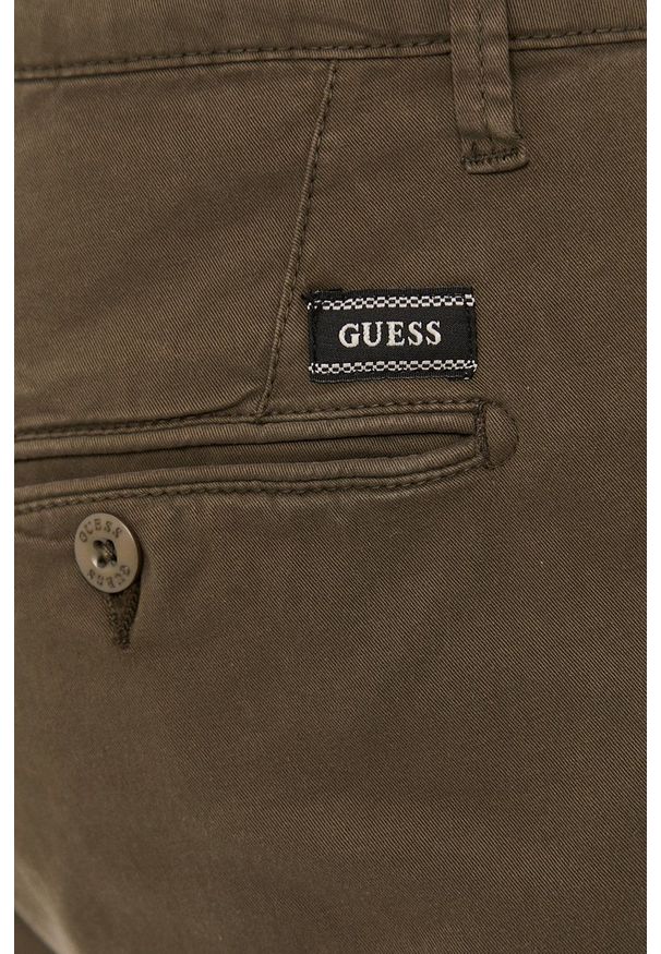Guess - Spodnie. Kolor: zielony. Materiał: tkanina