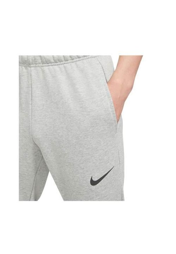 Spodnie sportowe męskie Nike Drifit Trapered. Kolor: szary. Materiał: dresówka. Długość: długie