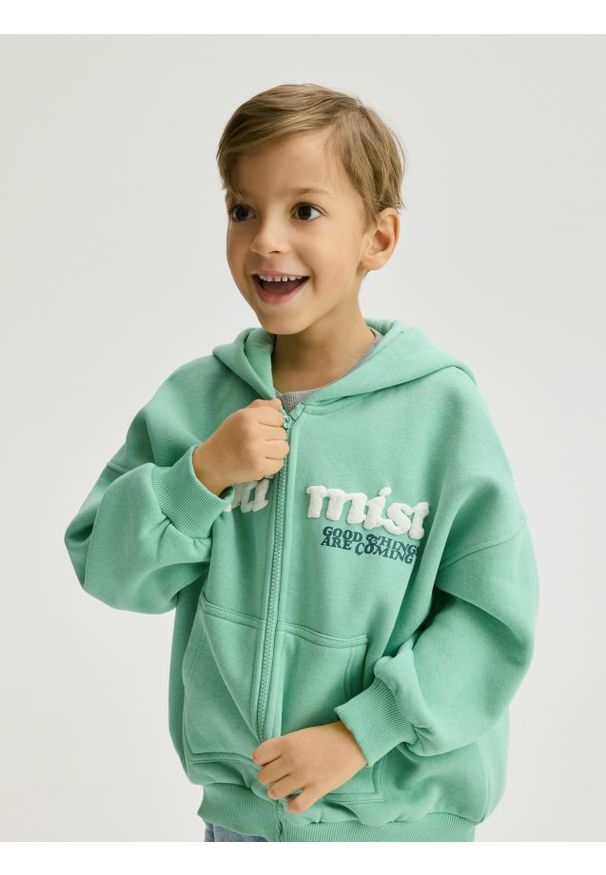 Reserved - Rozpinana bluza oversize - jasnoturkusowy. Kolor: turkusowy. Materiał: dzianina, bawełna