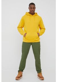 Jack Wolfskin bluza bawełniana męska kolor żółty z kapturem gładka. Typ kołnierza: kaptur. Kolor: żółty. Materiał: bawełna. Wzór: gładki