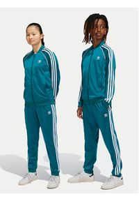 Adidas - adidas Spodnie dresowe adicolor SST IY7463 Turkusowy Regular Fit. Kolor: turkusowy. Materiał: syntetyk #7