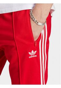 Adidas - adidas Spodnie dresowe adicolor Classics Beckenbauer IM4547 Czerwony Slim Fit. Kolor: czerwony. Materiał: bawełna