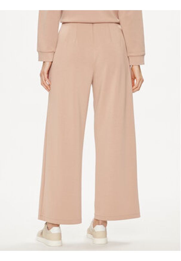 United Colors of Benetton - United Colors Of Benetton Spodnie dzianinowe 3UNN3F03B Beżowy Relaxed Fit. Kolor: beżowy. Materiał: syntetyk, wiskoza