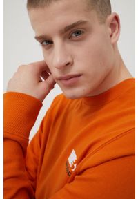 New Balance bluza MT13906VTO męska kolor pomarańczowy z nadrukiem. Okazja: na co dzień. Kolor: pomarańczowy. Materiał: bawełna. Wzór: nadruk. Styl: casual