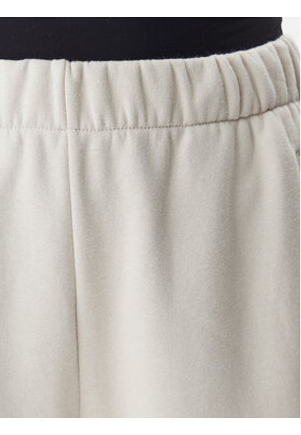 GAP - Gap Spodnie dresowe 765568-03 Beżowy Relaxed Fit. Kolor: beżowy. Materiał: bawełna