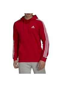 Adidas - Bluza adidas Essentials Fleece 3-Stripes Hoodie GU2523 - czerwona. Typ kołnierza: kaptur. Kolor: czerwony. Materiał: bawełna, poliester, wiskoza. Wzór: aplikacja. Styl: klasyczny #1