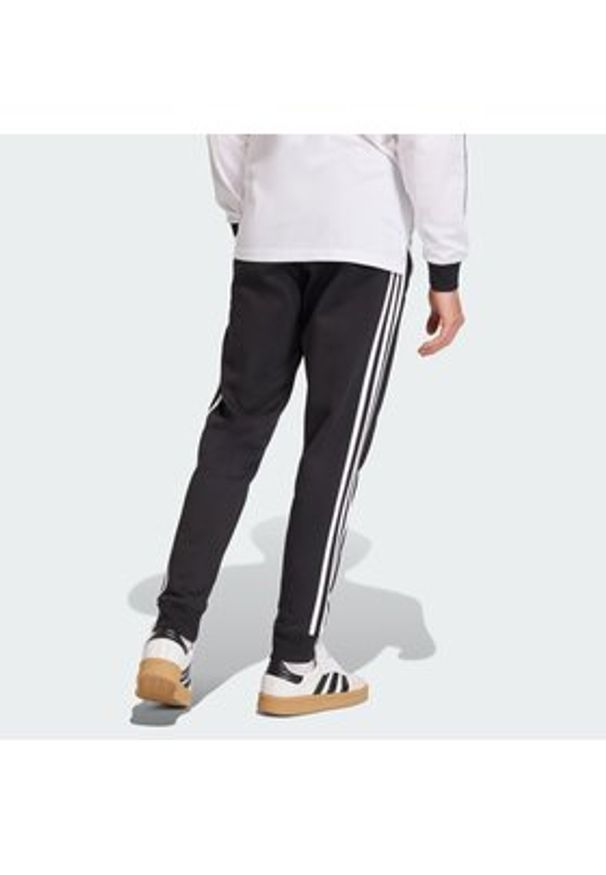 Adidas - adidas Spodnie dresowe 3-Stripes KE3562 Czarny Slim Fit. Kolor: czarny. Materiał: bawełna