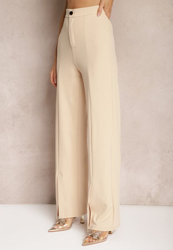 Renee - Beżowe Eleganckie Spodnie High Waist o Szerokim Kroju z Wiskozą i Rozcięciami Yurlea. Okazja: do pracy, na spotkanie biznesowe. Stan: podwyższony. Kolor: beżowy. Materiał: wiskoza. Styl: elegancki