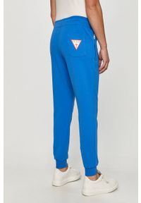 Guess - Spodnie. Kolor: niebieski. Materiał: dzianina. Wzór: gładki #2