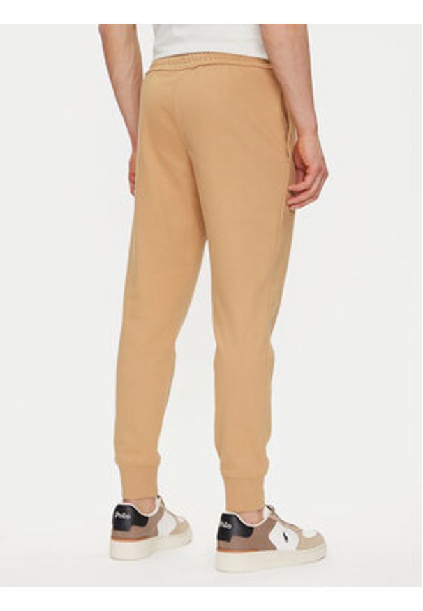 Timberland Spodnie dresowe TB0A5V5Q Beżowy Regular Fit. Kolor: beżowy. Materiał: bawełna