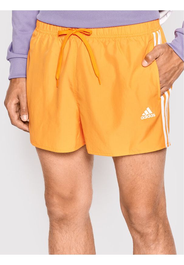 Adidas - adidas Szorty kąpielowe Classic 3-Stripes HA0401 Pomarańczowy Regular Fit. Kolor: pomarańczowy. Materiał: syntetyk