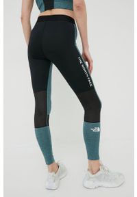 The North Face legginsy sportowe Mountain Athletics damskie kolor czarny wzorzyste. Kolor: czarny. Materiał: materiał, skóra, włókno. Styl: sportowy