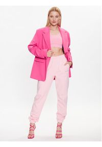 ROTATE Spodnie dresowe Crystal 700157043 Różowy Relaxed Fit. Kolor: różowy. Materiał: bawełna