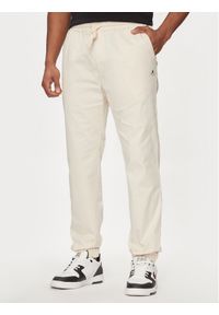 Champion Spodnie dresowe 219865 Beżowy Custom Fit. Kolor: beżowy. Materiał: bawełna #1