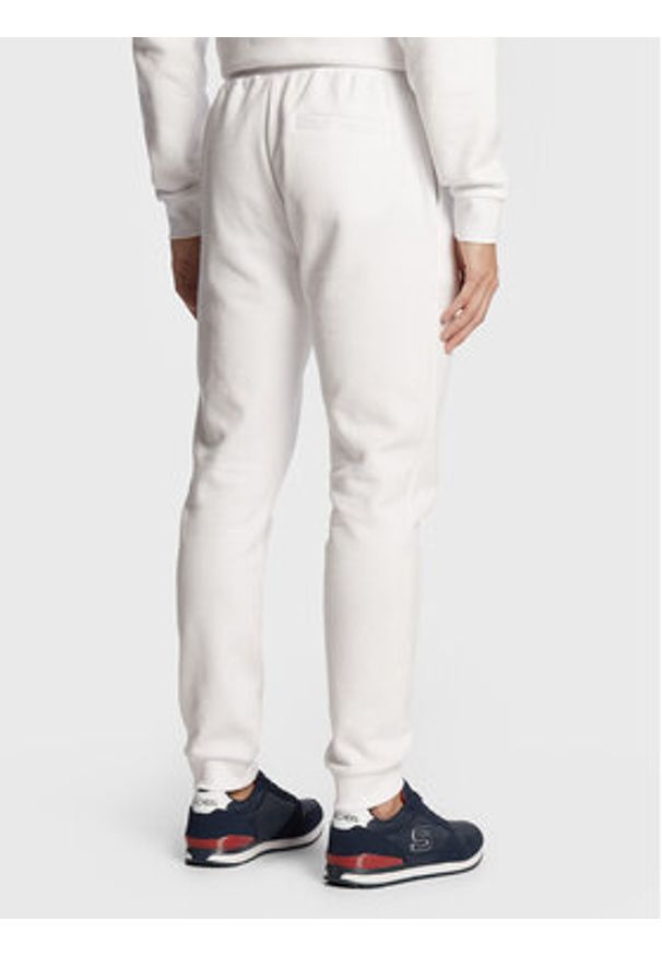 Ellesse Spodnie dresowe Ovest SHS01763 Biały Regular Fit. Kolor: biały. Materiał: bawełna