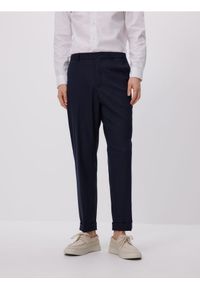 Reserved - Spodnie garniturowe z wiskozą - granatowy. Kolor: niebieski. Materiał: wiskoza
