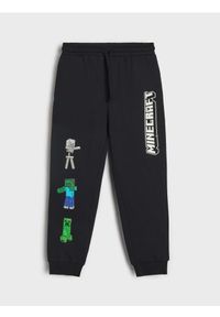 Sinsay - Spodnie dresowe Minecraft - czarny. Kolor: czarny. Materiał: dresówka #1