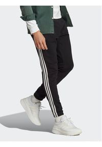 Adidas - adidas Spodnie dresowe Essentials French Terry Tapered Elastic Cuff 3-Stripes Joggers IC0050 Czarny Regular Fit. Kolor: czarny. Materiał: bawełna, dresówka #5