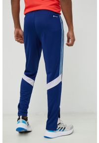 Adidas - adidas spodnie treningowe Tiro męskie kolor niebieski z aplikacją. Kolor: niebieski. Materiał: materiał, dzianina, skóra. Wzór: aplikacja. Sport: fitness #2