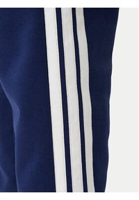 Adidas - adidas Spodnie dresowe Essentials 3-Stripes JE6334 Granatowy Regular Fit. Kolor: niebieski. Materiał: bawełna #3