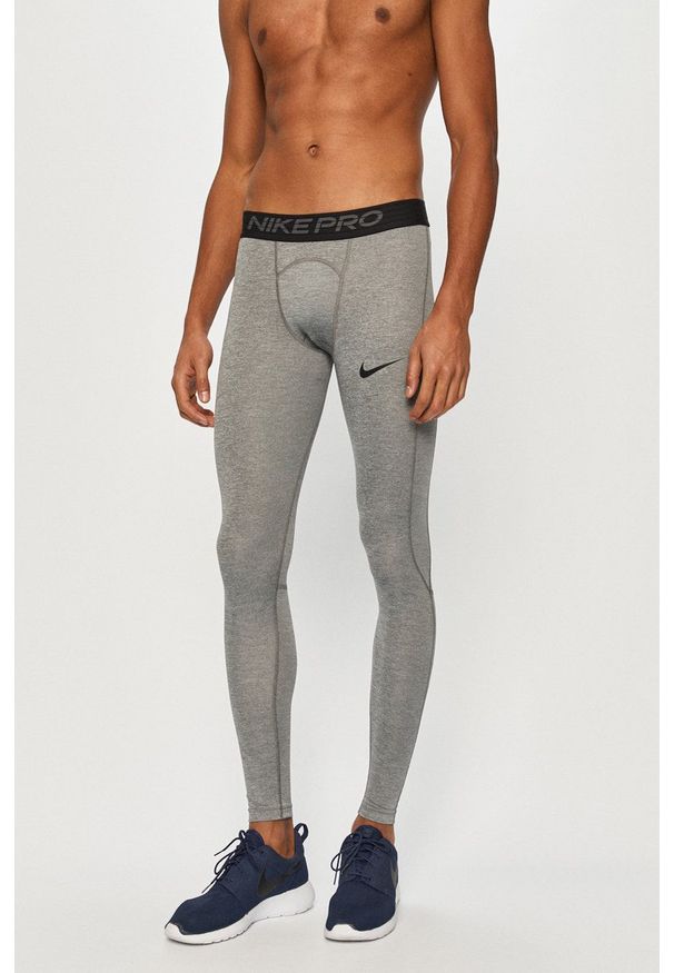 Nike - Legginsy. Kolor: szary. Materiał: dzianina, tkanina, włókno, skóra