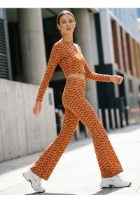 Sinsay - Legginsy flare ze wzorem geometrycznym - wielobarwny. Wzór: geometria #1